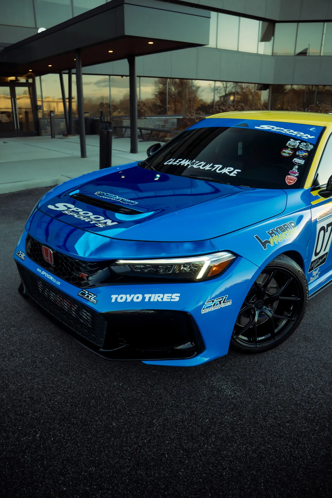 Close crop of the blue hood and front bumper of a Honda Civic with Spoon Sports livery